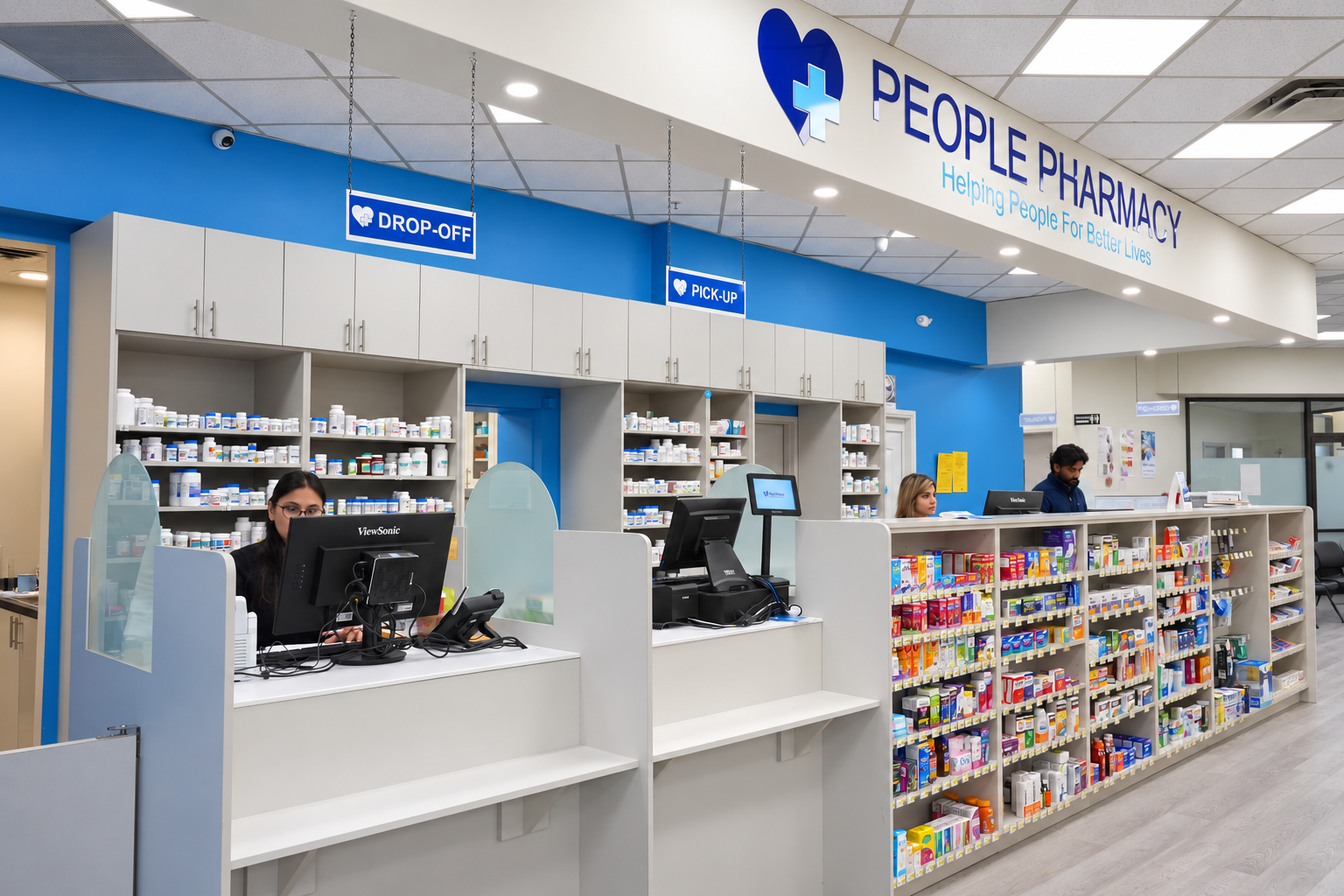 Pharmacists helping patients at the Barrie Peoples Pharmacy counter